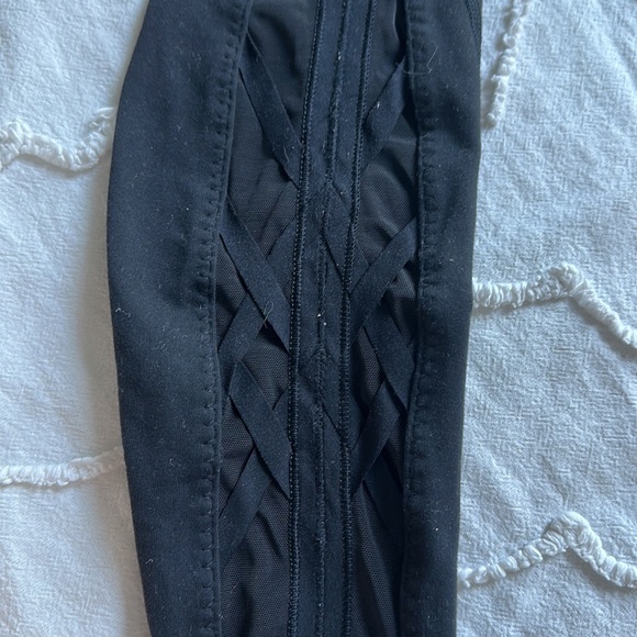 Black Lululemon leggings with criss cross on bottom of legs - Picture 4 of 4